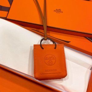 Hermes Orange bag charm